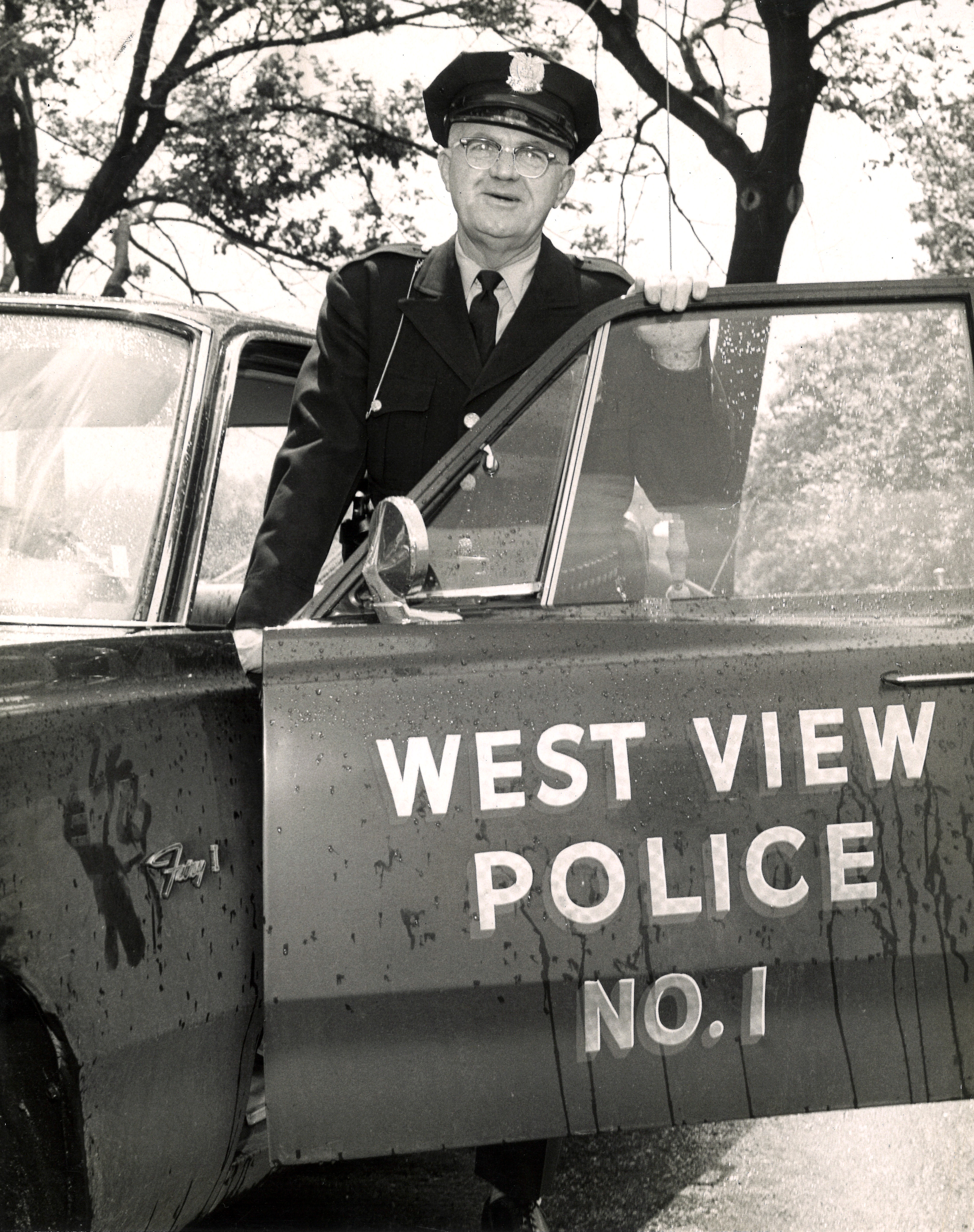 Chief Farley with police car